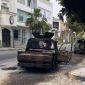 A burned vehicle lies abandoned in a Tripoli street following armed clashes between rival security forces. Source : Social media.