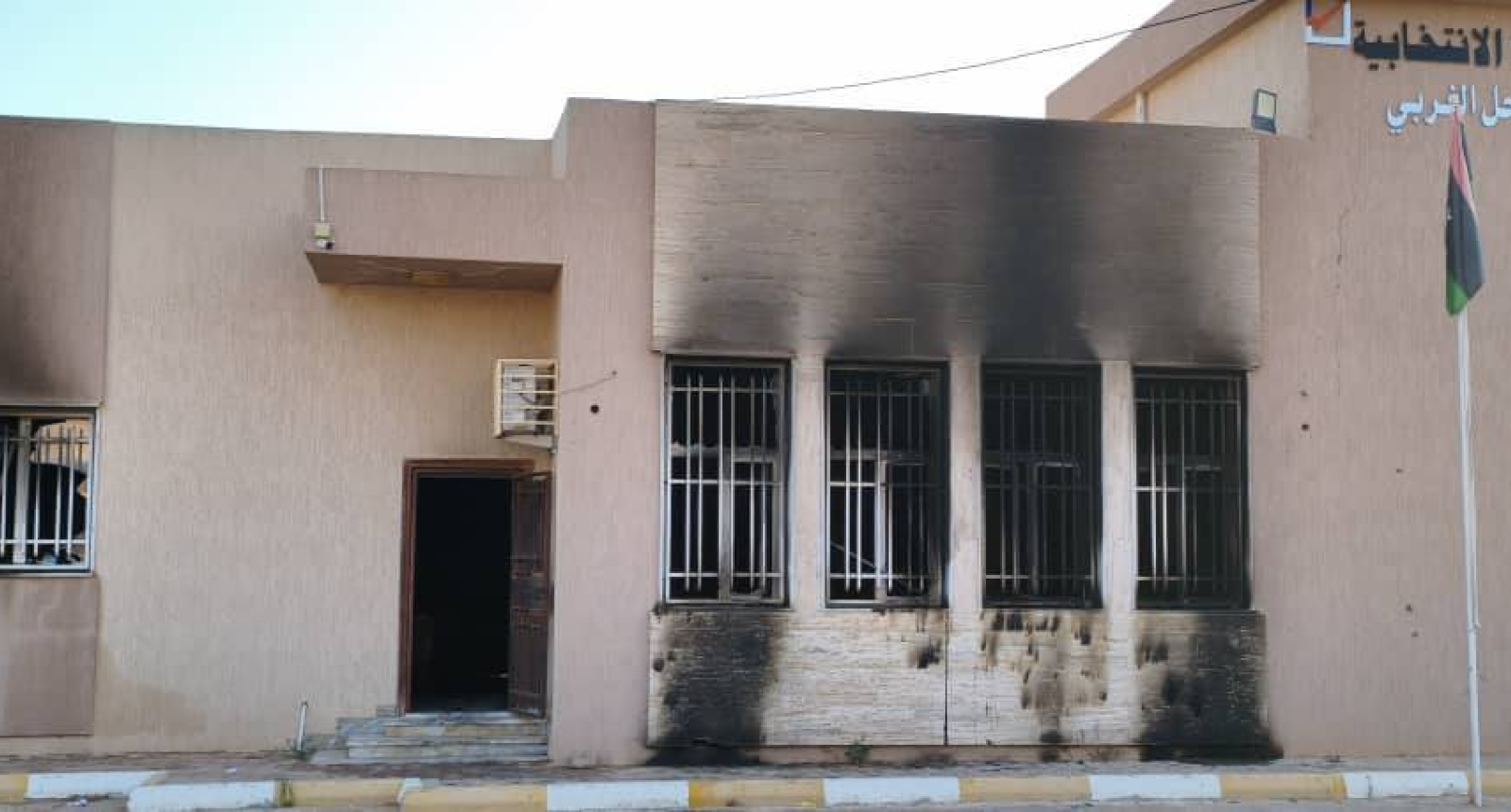 The Electoral Management building in the city of Zawiya after being attacked and having fires set in its warehouses – Source: Social media