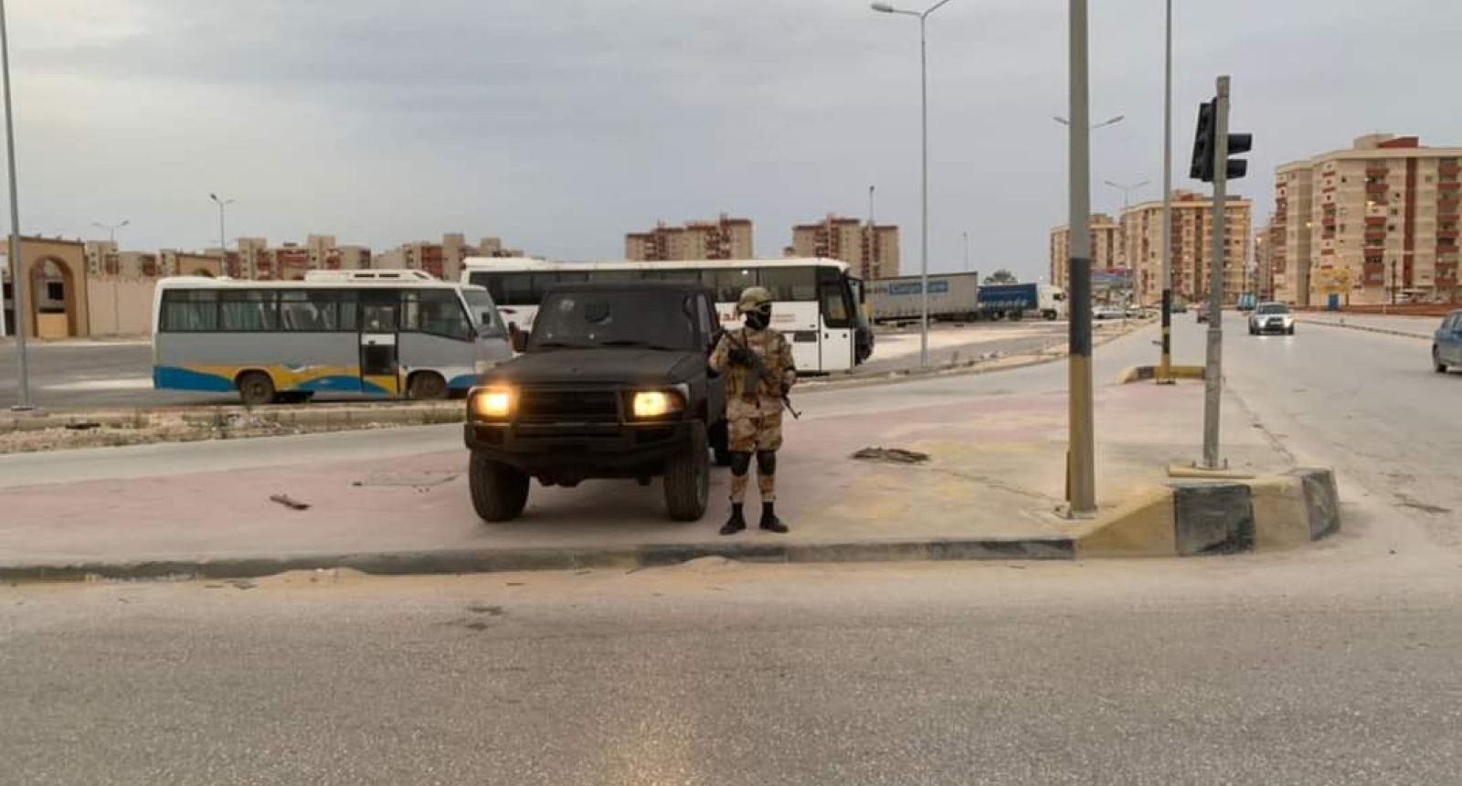 a man standing next to a truck