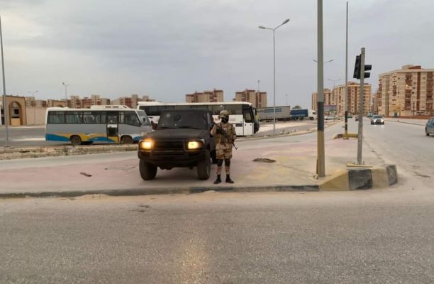 a man standing next to a truck