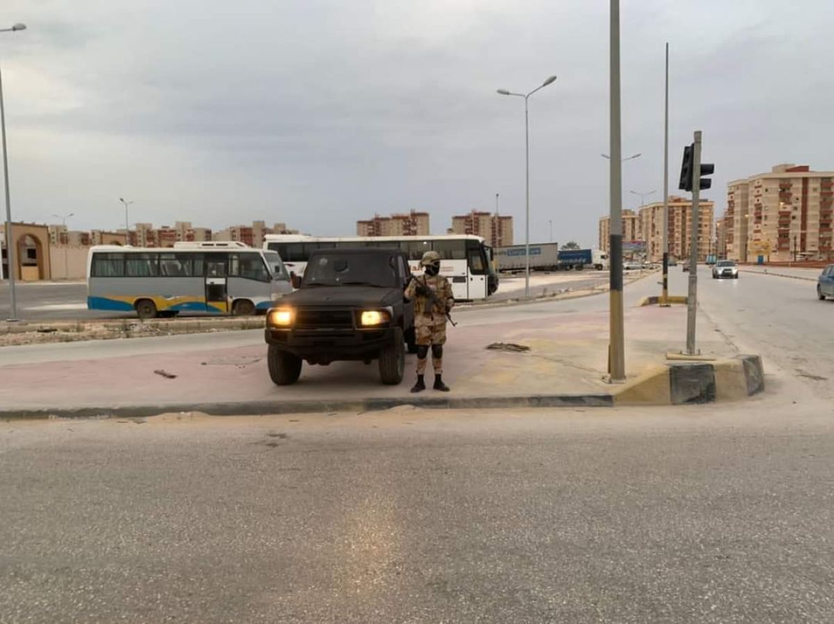 a man standing next to a truck