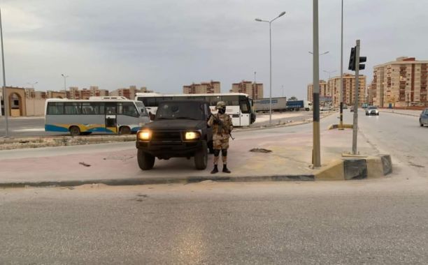 a man standing next to a truck